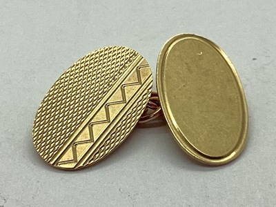 Lot 70 - A 9ct Gold Oval Cufflink (Odd), the engine...