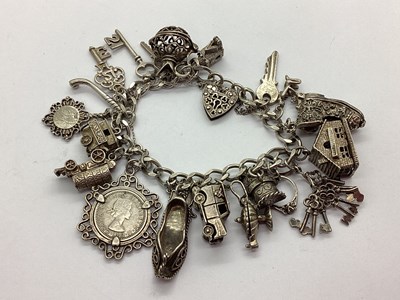 Lot 131 - A Flat Curb Link Charm Bracelet, to part...