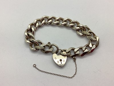 Lot 129 - A Hallmarked Silver Flat Curb Link Bracelet,...