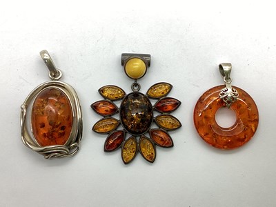 Lot 90 - A Modern Amber Coloured Pendant, of oval form,...