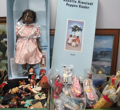 Lot 1016 - A large collection of dolls dressed in...