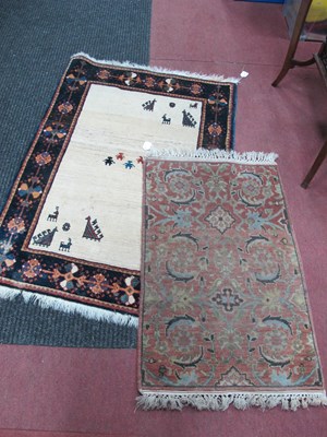 Lot 1621 - Middle Eastern Wool Tasselled Rug, featuring...