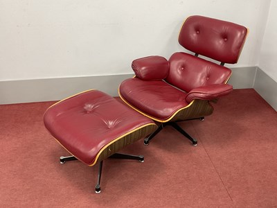 Lot 1594 - An Eames Style Red Leather Lounge Chair,...