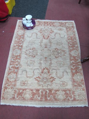 Lot 1178 - Salmon Pink & Cream Tasselled Rug, with...