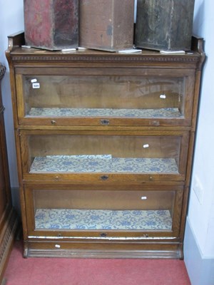 Lot 1689 - The Lebris Oak Sectional Bookcase, with shaped...