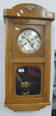 Lot 1570 - XX Century Oak Wall Clock, with a silver dial,...