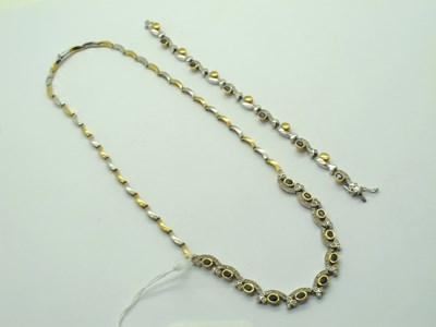 Lot 121 - A Fancy Modern Two Colour Gold Sapphire and...