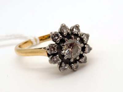 Lot 113 - A Diamond Cluster Ring, claw set throughout...