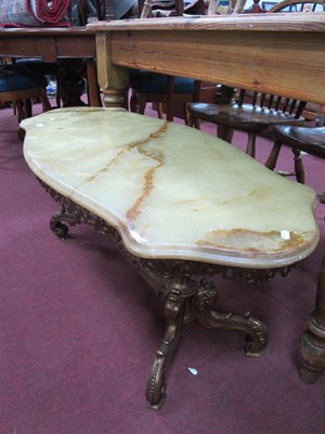 Lot 1606 - An Onyx topped coffee table on gilt painted...