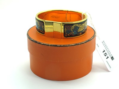 Lot 151 - Hermès; A 'Clic Clac' Gilt Metal and Enamel...