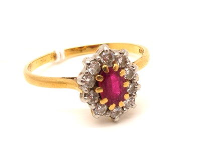 Lot 123 - An 18ct Gold Diamond Set Cluster Ring, oval...