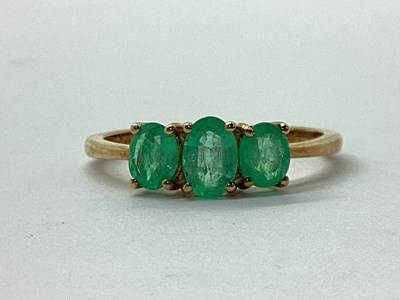 Lot 50 - A 9ct Gold Oval Three Stone Emerald Ring, claw...