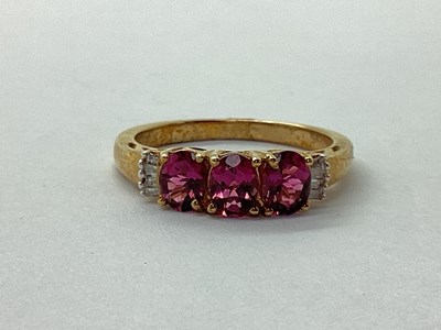 Lot 52 - A 9ct Gold Oval Three Stone Ring, claw set...
