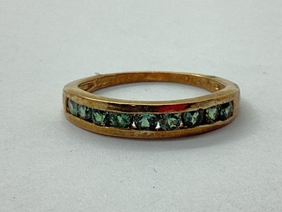Lot 53 - A 9ct Gold Channel Set Band, of uniform design...