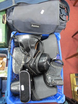 Lot 1381 - Cameras; A camera bag containing Praktica MTL3...