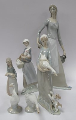 Lot 1249 - Lladro and Nao figurines, including Girl with...