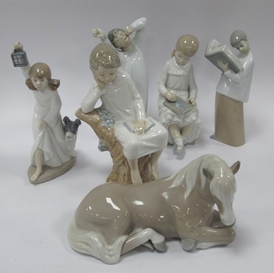 Lot 1223 - Lladro and Nao Figurines, to include kneeling...