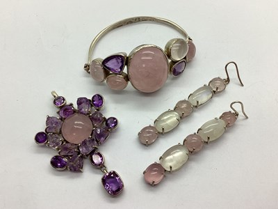 Lot 142 - A Modern Hardstone Cluster Pendant, with...