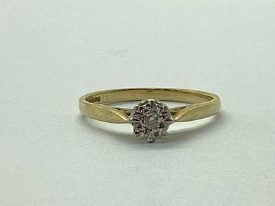 Lot 68 - A 9ct Gold Illusion Set Diamond Ring, between...