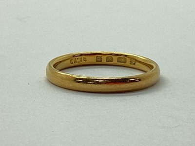 Lot 60 - A 22ct Gold Plain Wedding Band, London 1929...