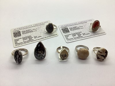 Lot 158 - Gemporia; An Oval Fossil Red Coral Dress Ring,...