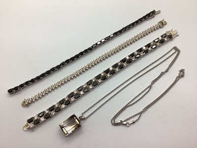 Lot 150 - A Modern Two Row Line Bracelet, of alternating...