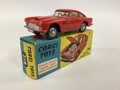 Lot 928 - Corgi Toys No 218 Aston Martin DB4 Red,...