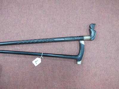 Lot 1148 - Two Ebonised Walking Canes with Silver Mounts,...
