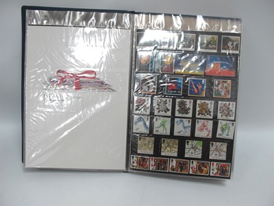 Lot 561 - Stamps; An album containing G.B. Royal Mail...