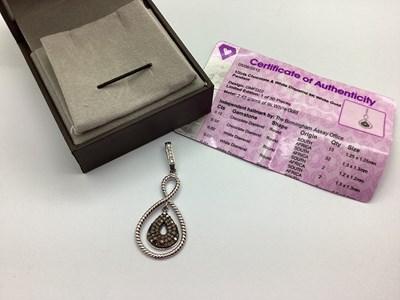 Lot 106 - A 9ct White Gold Chocolate and White Diamond...
