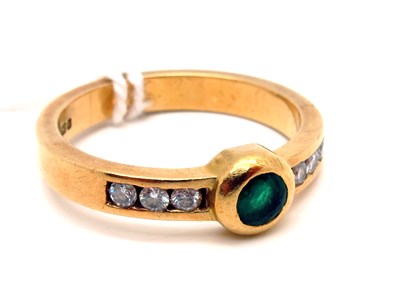 Lot 126 - A Modern 18ct Gold Emerald and Diamond Ring,...