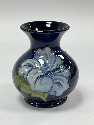 Lot 1262 - A Moorcroft vase in the 'Hibiscus' pattern on...