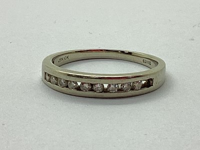 Lot 37 - A Channel Set Diamond Half Eternity Style Ring,...