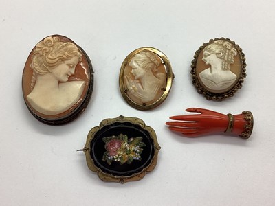 Lot 147 - An Antique Coral Coloured Brooch, in the form...