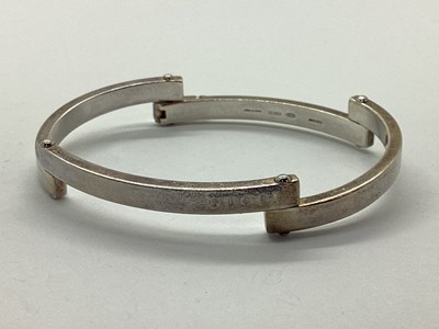 Lot 160 - Gucci; A Hallmarked Silver Hinged Panel...