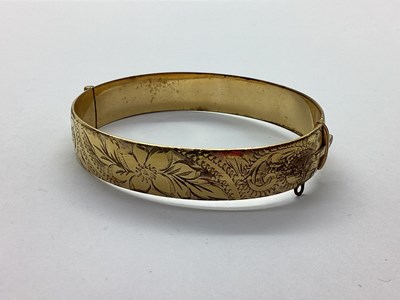 Lot 161 - A Gilt Coloured Hinged Bangle, of half floral...