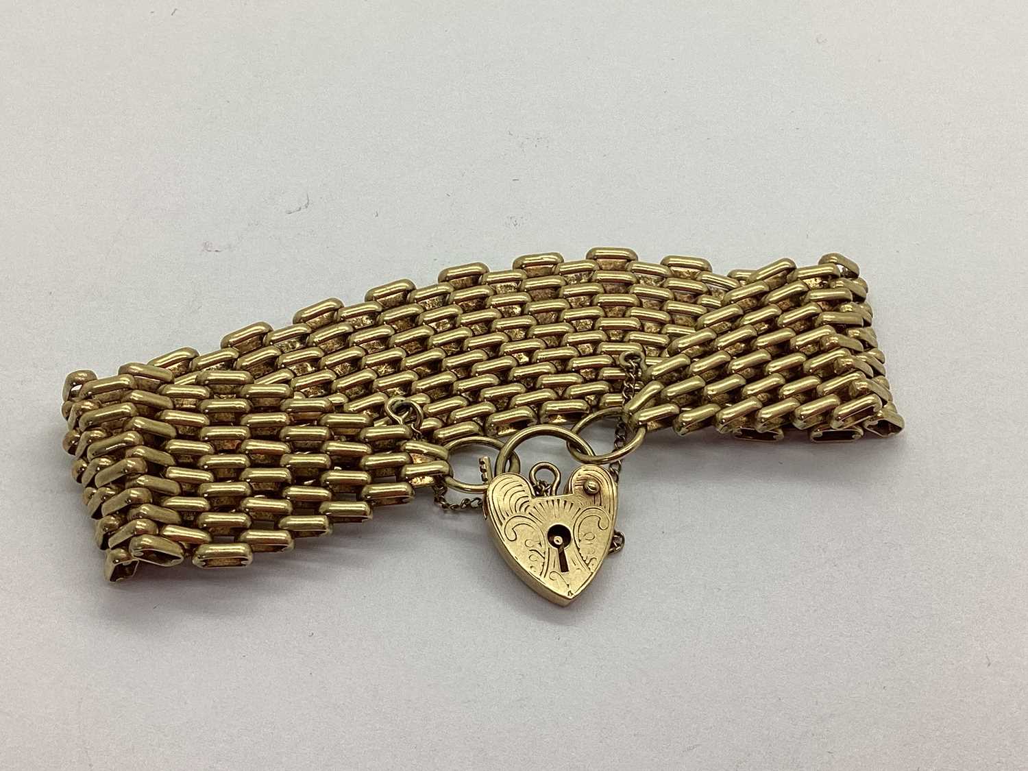 Lot 85 - A 9ct Gold Brick Link Bracelet, tapering to...