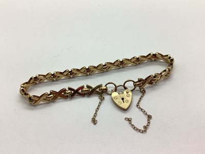 Lot 86 - A 9ct Gold Cross Style Link Bracelet, to heart...