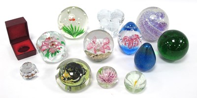 Lot 1253 - Twelve art glass paperweights, assorted forms...