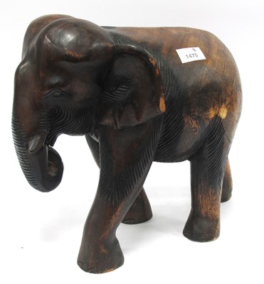 Lot 1475 - Large hand-carved solid hardwood elephant...