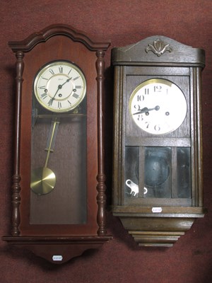 Lot 1178 - Two vintage wooden wall clocks: Hermle and a...