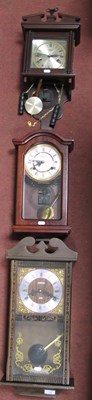 Lot 1186 - Three wooden cased wall clocks: Talisman 8 Day,...