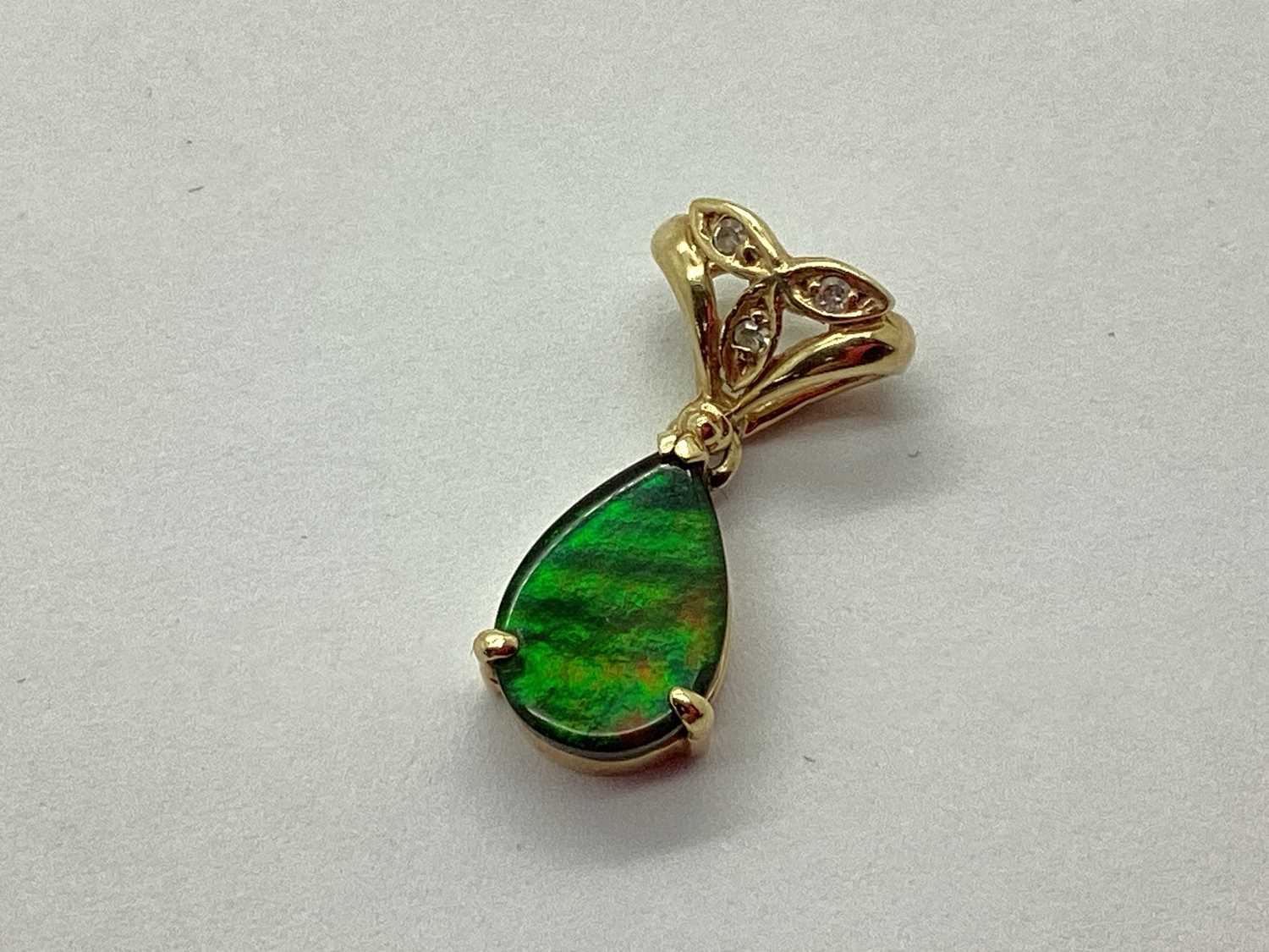 Lot 78 - A Teardrop Shape Decorative Drop Pendant, claw...