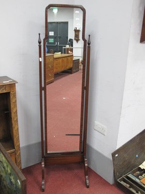 Lot 1595 - XX Century mahogany cheval mirror with shaped...