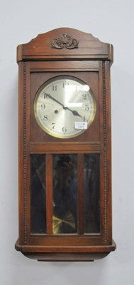 Lot 1201 - 1940's Oak Wall Clock, with silvered dial and...