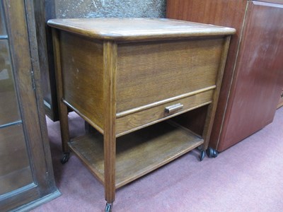 Lot 1549 - Oak Sewing Table; together with a sewing cabinet.