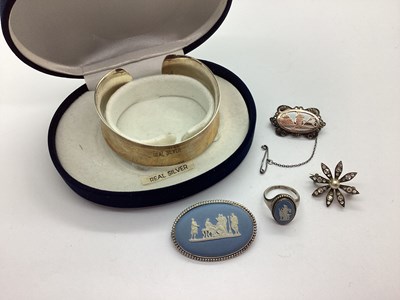 Lot 128 - Wedgwood; A Blue Jasperware Oval Brooch,...