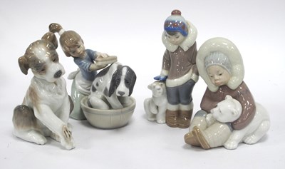 Lot 1312 - Lladro Dog, 13cm high, two Eskimos with bear...