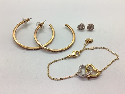 Lot 92 - Swarovski; A Gilt Coloured Interlocking Heart...