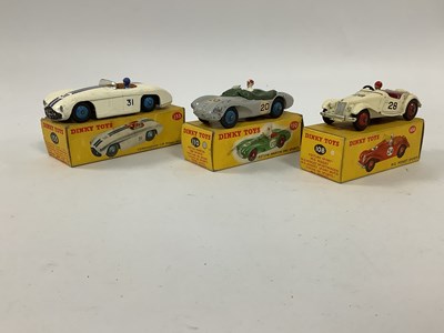 Lot 873 - Three Dinky Toys No 133 Cunningham Road Racer,...